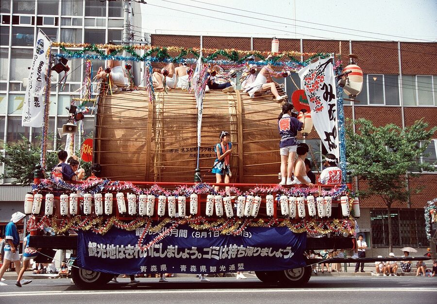A large illuminated Nebuta float on the streets of Aomori City during the August festival