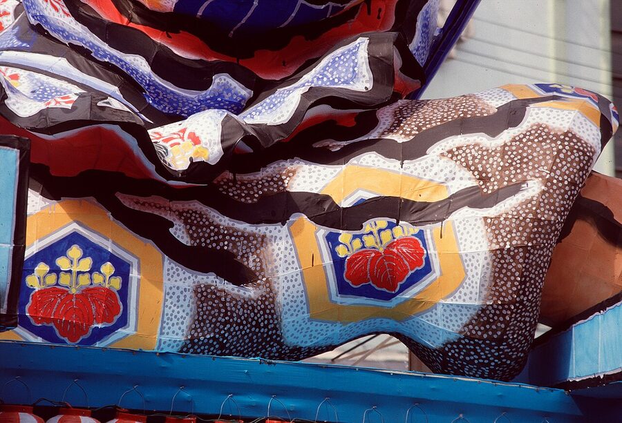 Nebuta float warriors in profile during the night parade