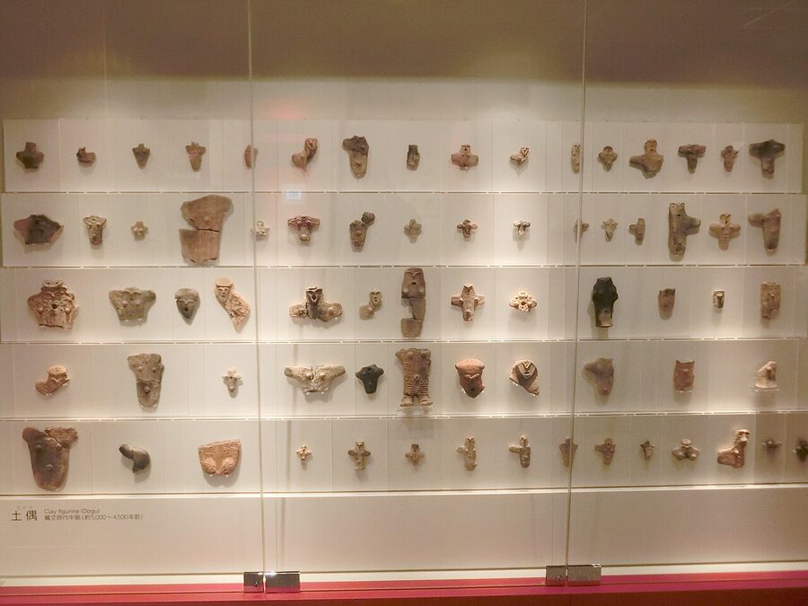 A small clay Jomon figurine on display at Sannai-Maruyama