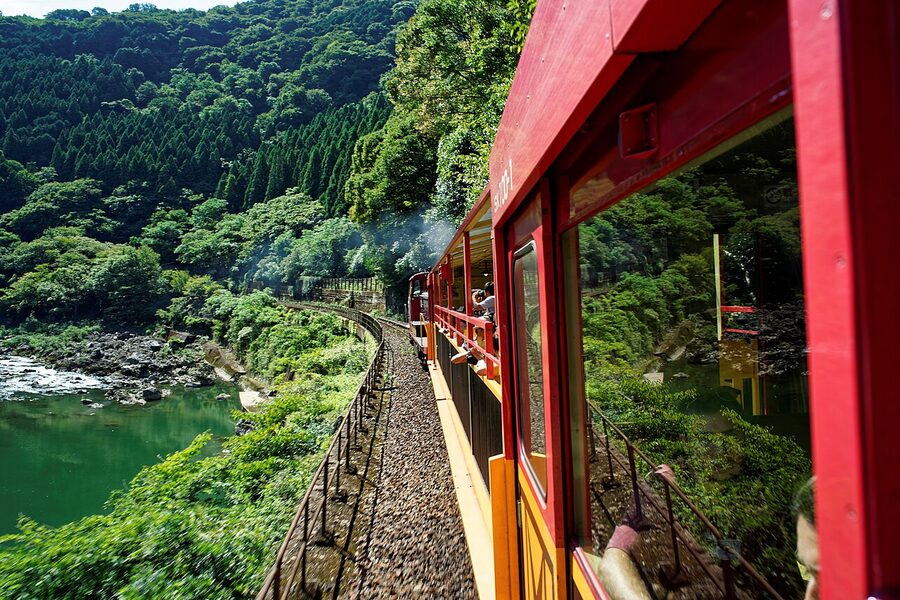 Sagano Scenic Railway train above Hozu River viaduct gorge view