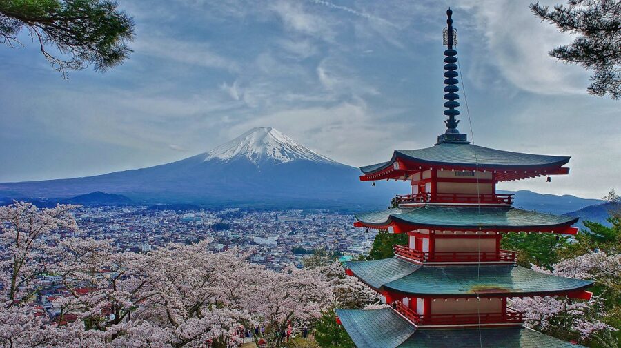 Chureito Pagoda framed by cherry blossoms with Mount Fuji in the background