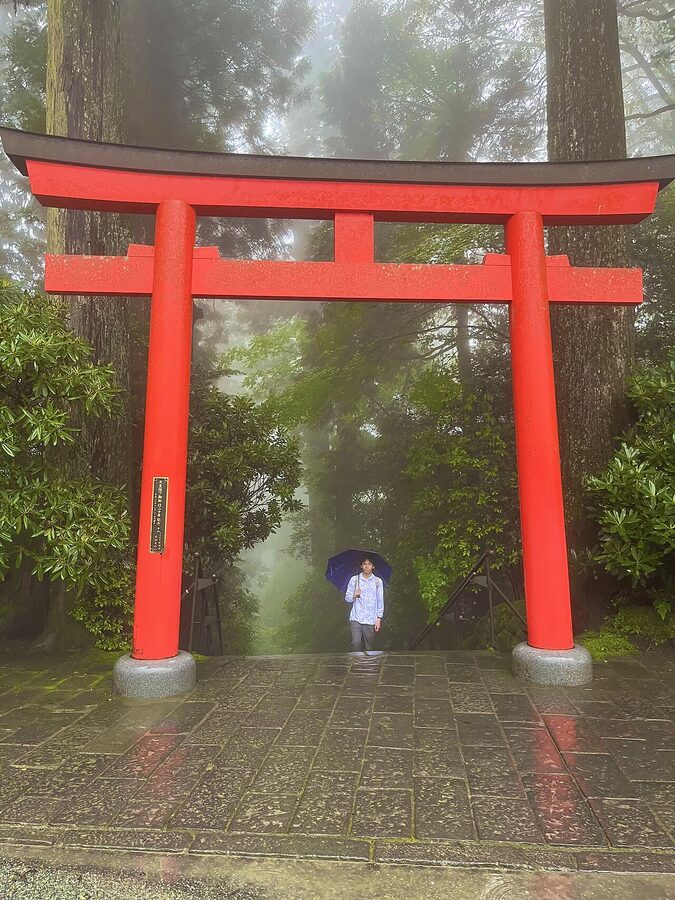 Main hall of Hakone Shrine surrounded by cedars