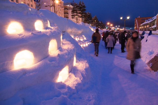 Candle-in-snow lanterns lining the Otaru Yuki Akari no Michi festival path.