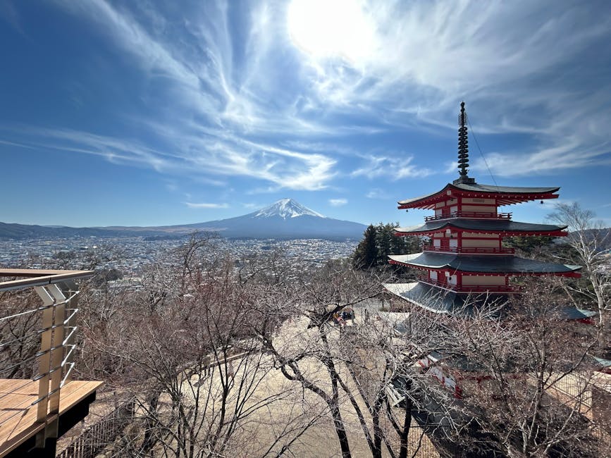 Mt. Fuji rising behind the Chureito Pagoda under clear sky