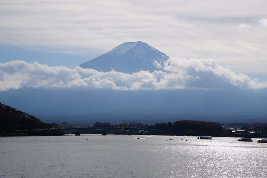 Mt. Fuji over Lake Kawaguchi in autumn with reflections in still water