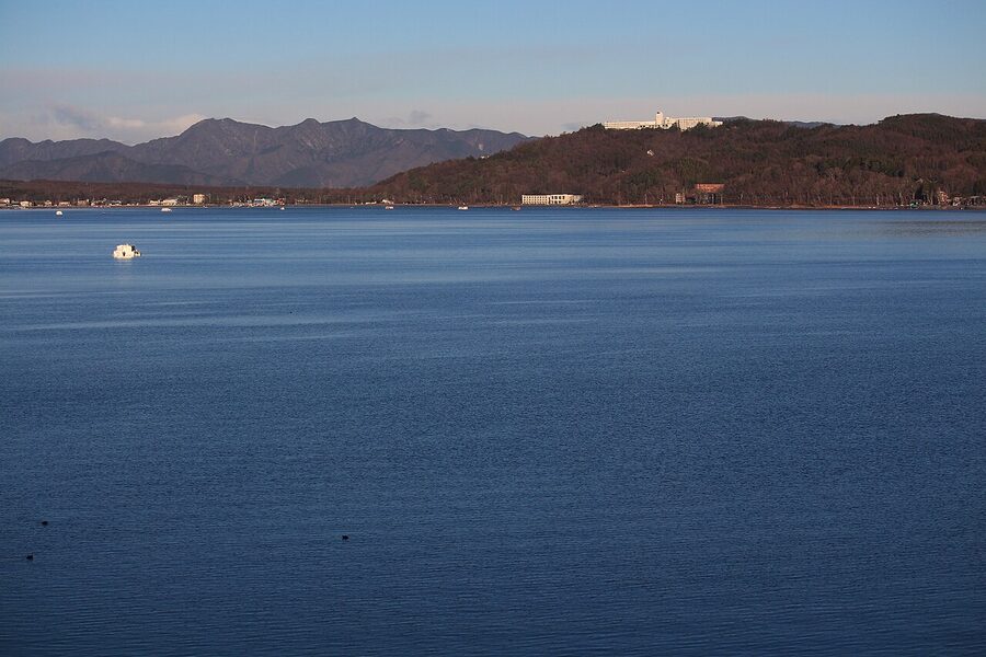 Mt. Fuji over Lake Yamanaka with Hotel Mt Fuji on the lakeside