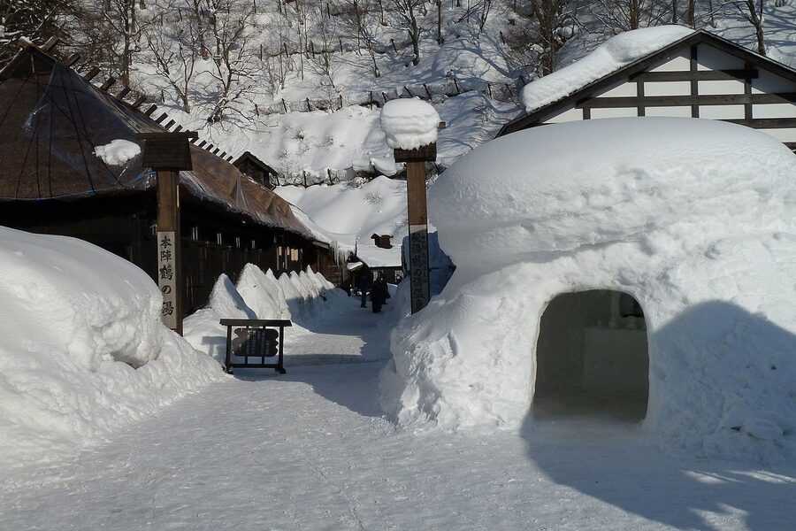 Tsuru-no-yu wooden bathhouse and milky outdoor pool at Nyuto Onsenkyo
