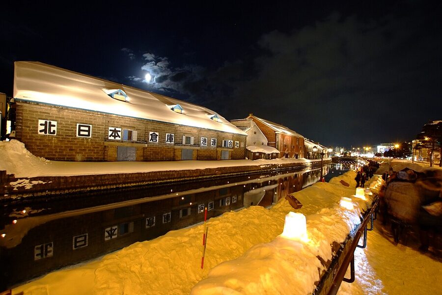 Candles in snow lanterns along the Otaru Canal during the Snow Light Path Festival