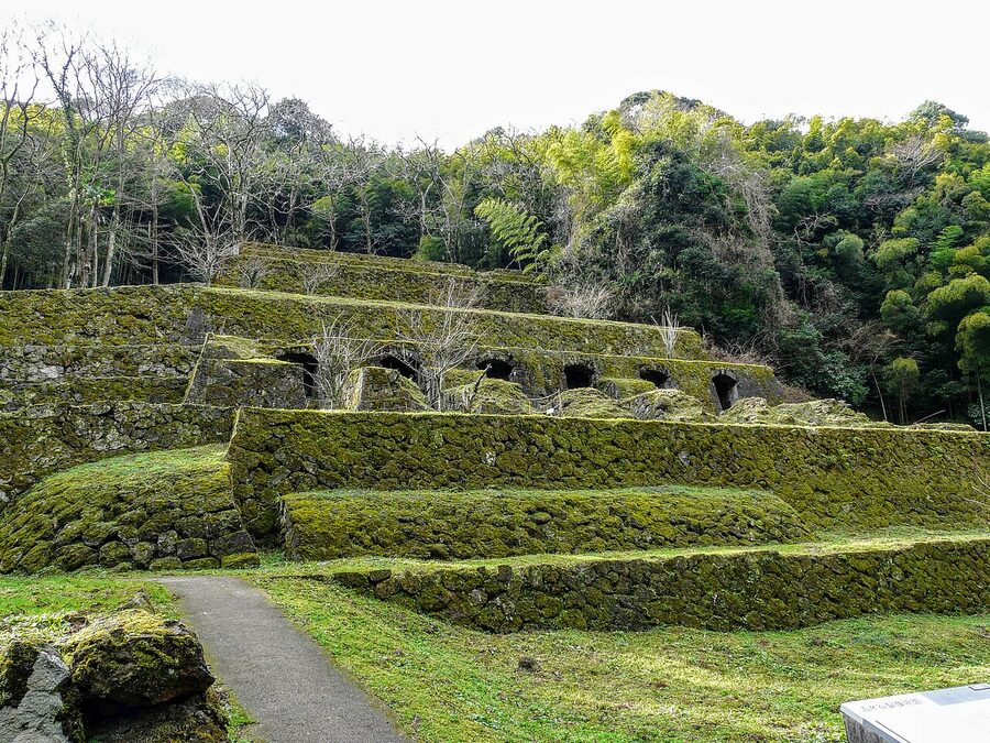 The Shimizudani Refinery ruins at Iwami Ginzan, brick foundations among forest.