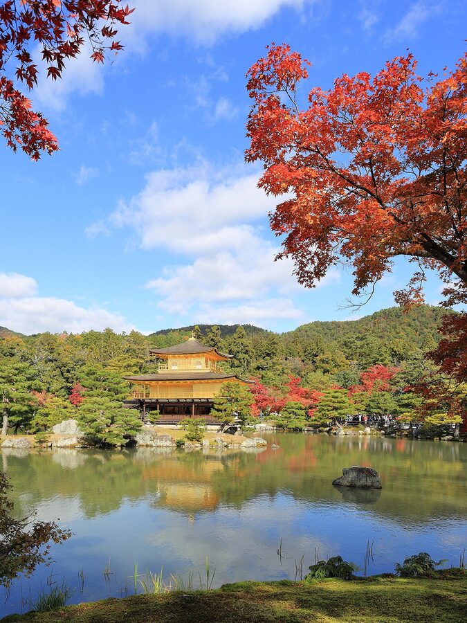 Kinkaku-ji, the Golden Pavilion, in autumn at its reflection pond.
