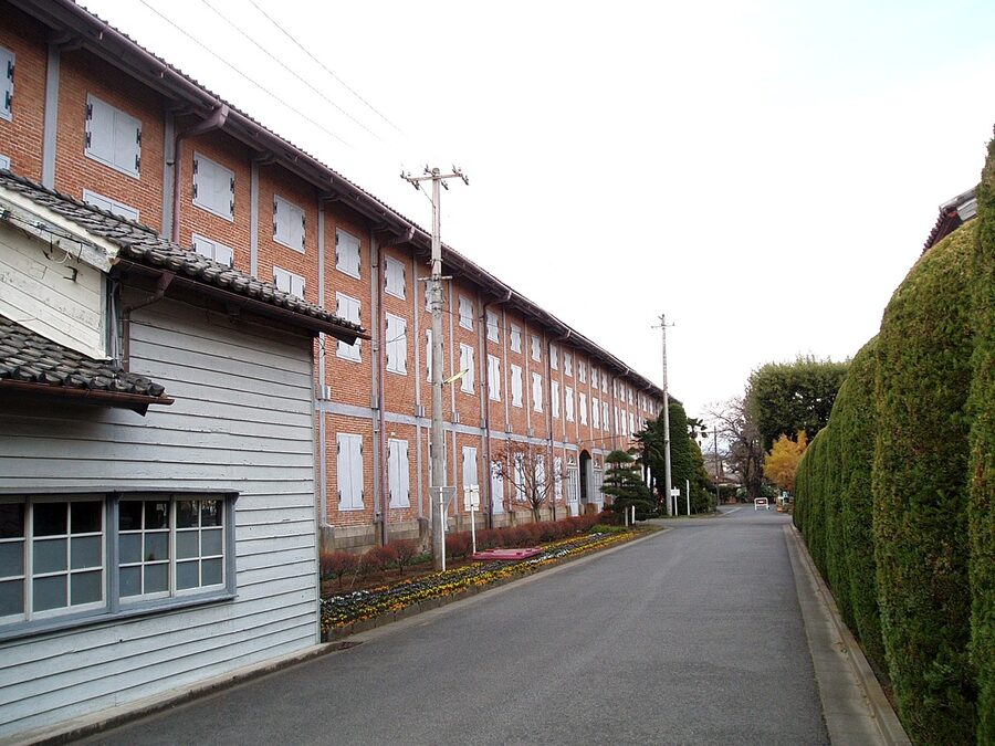 The east cocoon warehouse at Tomioka Silk Mill, brick facade with arched windows.