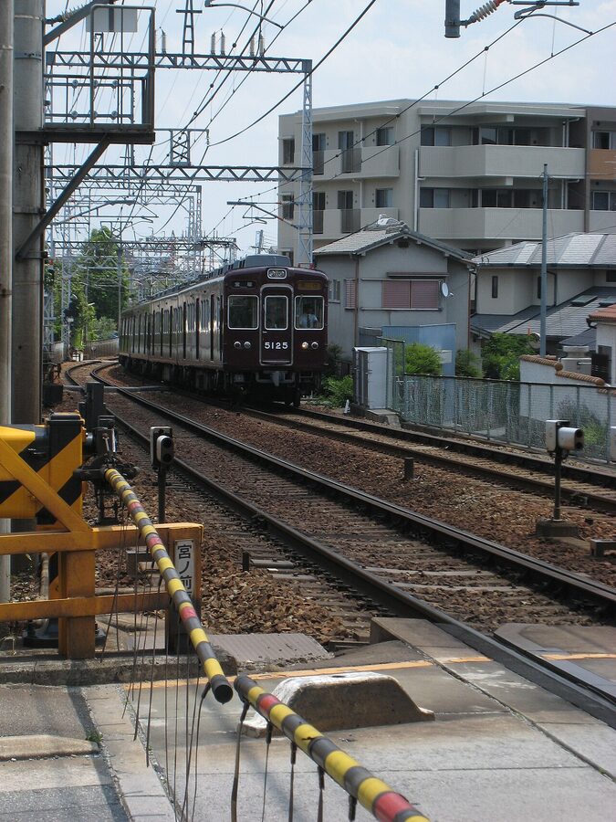 Hankyu train with passengers boarding