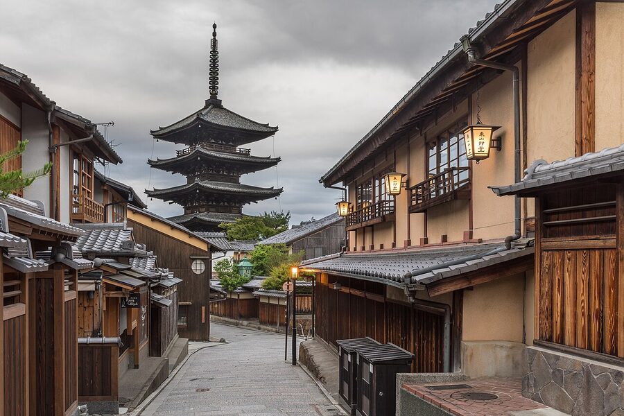 Yasaka Pagoda rising over Yasaka-dori in the Higashiyama district at early morning, lit by street lanterns