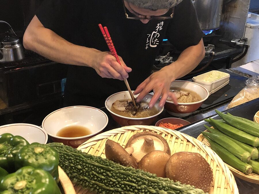 Yatai chef preparing Hakata ramen at the Yatai Keiji food stall