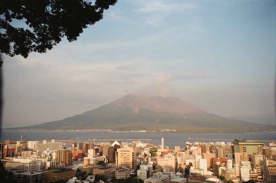 Kagoshima city waterfront with Sakurajima volcano across the bay