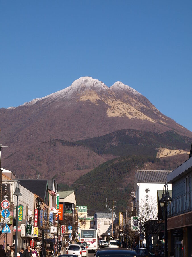 Yufuin town with the twin peaks of Mount Yufu in the background