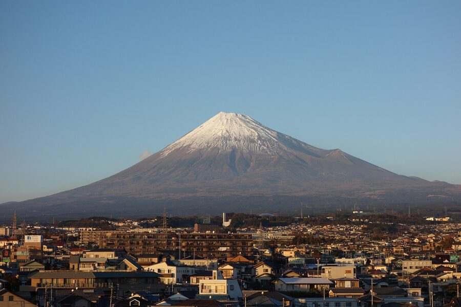 Climbers ascending Mt Fuji at sunset