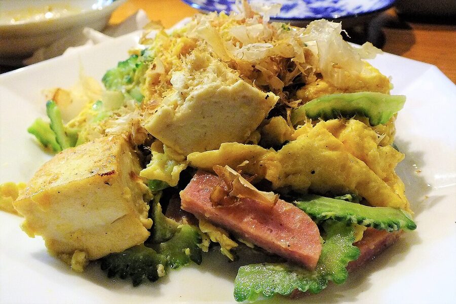 A plate of goya champuru with bitter melon, tofu, egg and pork belly