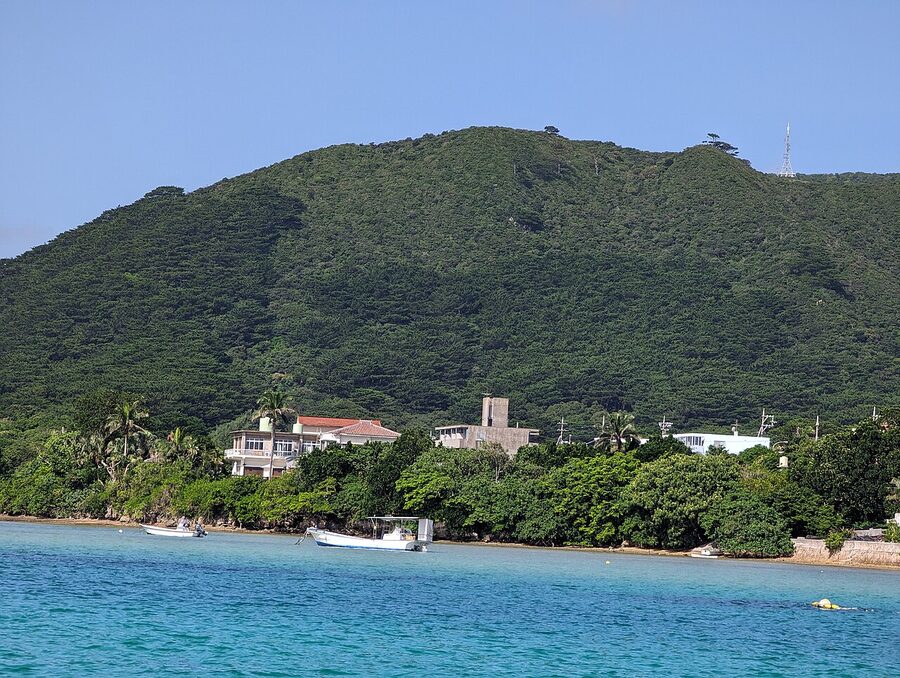 The aquamarine water of Kabira Bay on Ishigaki Island, with small islets dotted offshore