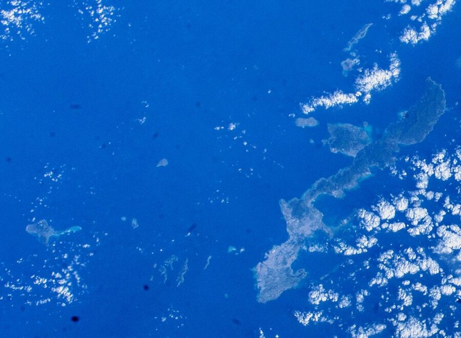 The Okinawa Islands seen from the International Space Station, a chain of green specks in dark sea