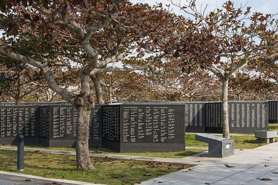 The Cornerstone of Peace at Itoman Peace Memorial Park, polished black stone walls inscribed with names