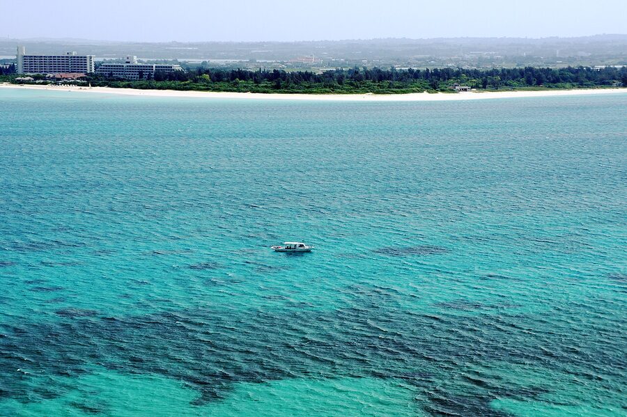 Yonaha Maehama Beach on Miyakojima, a long arc of white sand against pale turquoise water