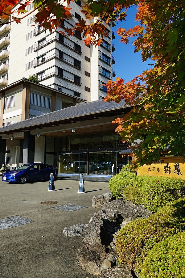 Outdoor riverside scenery at Akiu Onsen in Sendai with surrounding wooded mountains