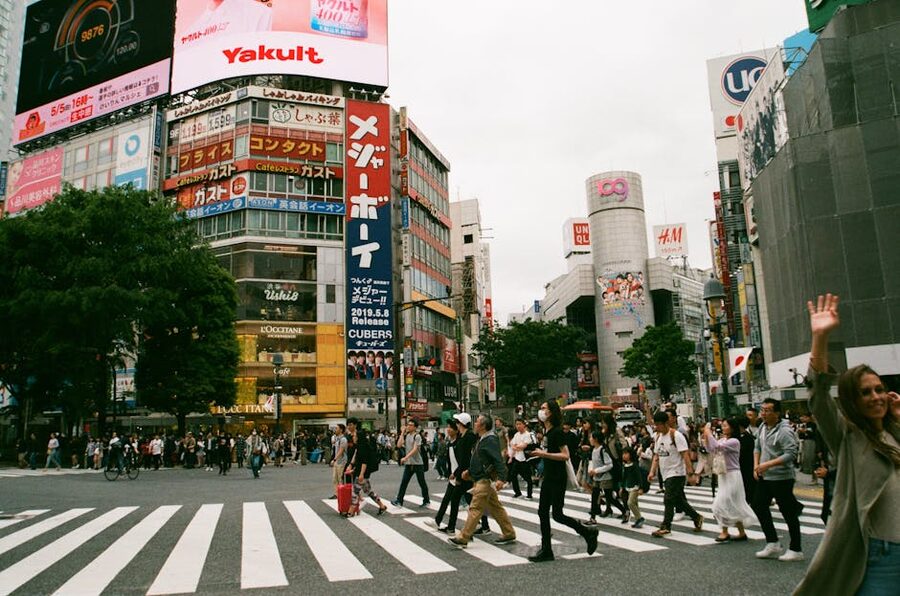 People walking across Shibuya intersection in Tokyo