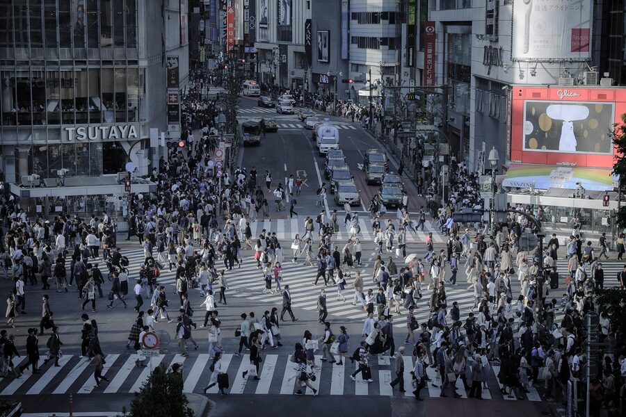 Shibuya intersection with vehicles and billboards