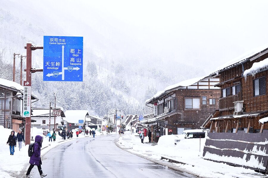A wide-angle view of Ogimachi village in deep winter snow