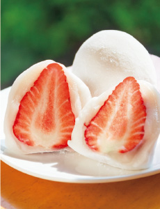 Ichigo daifuku with red bean paste and a fresh strawberry inside a glutinous rice cake