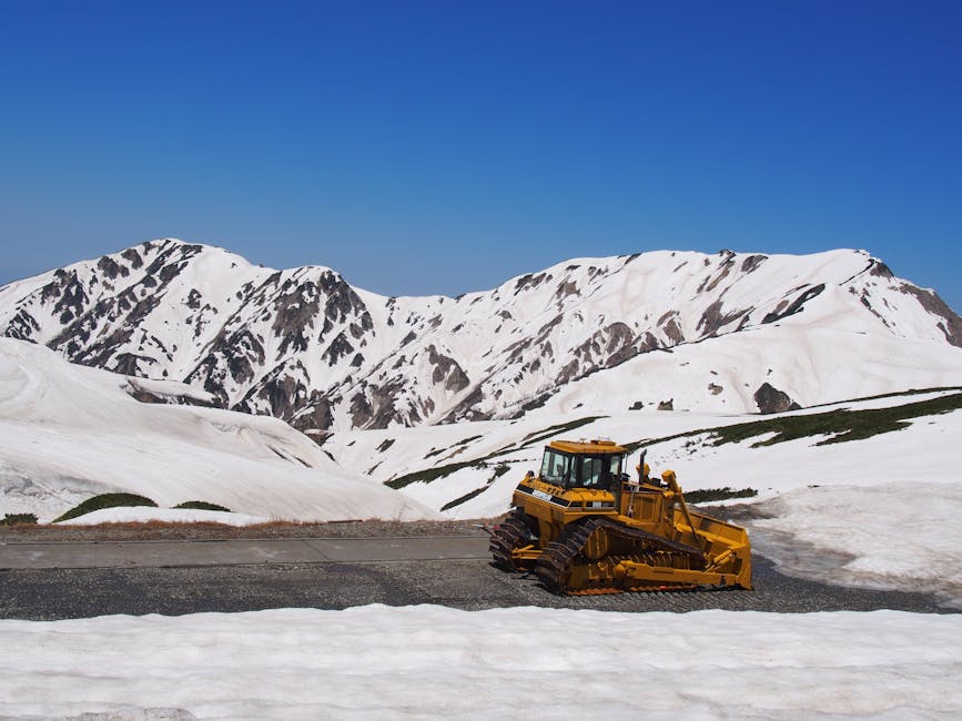 Snowplough clearing the road through Tateyama snow walls in spring