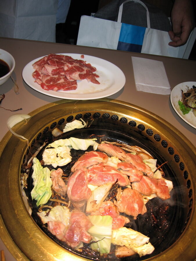 Jingisukan grilled lamb on a domed cast-iron pan