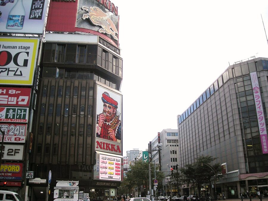 Susukino entertainment district at night with neon signs and crowds