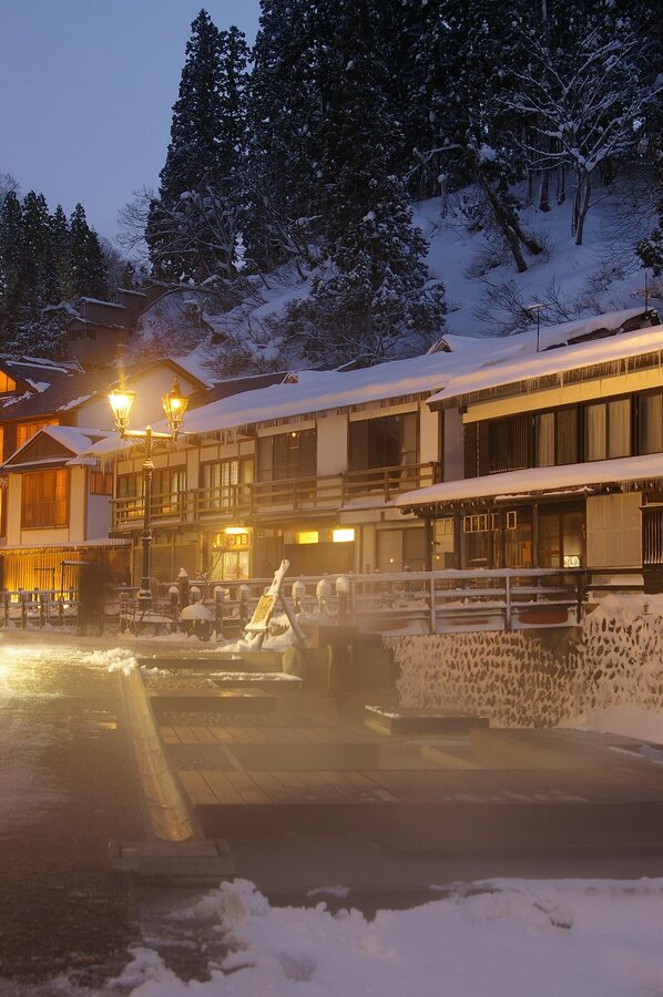 Ginzan Onsen river and the wooden inns reflected in the water