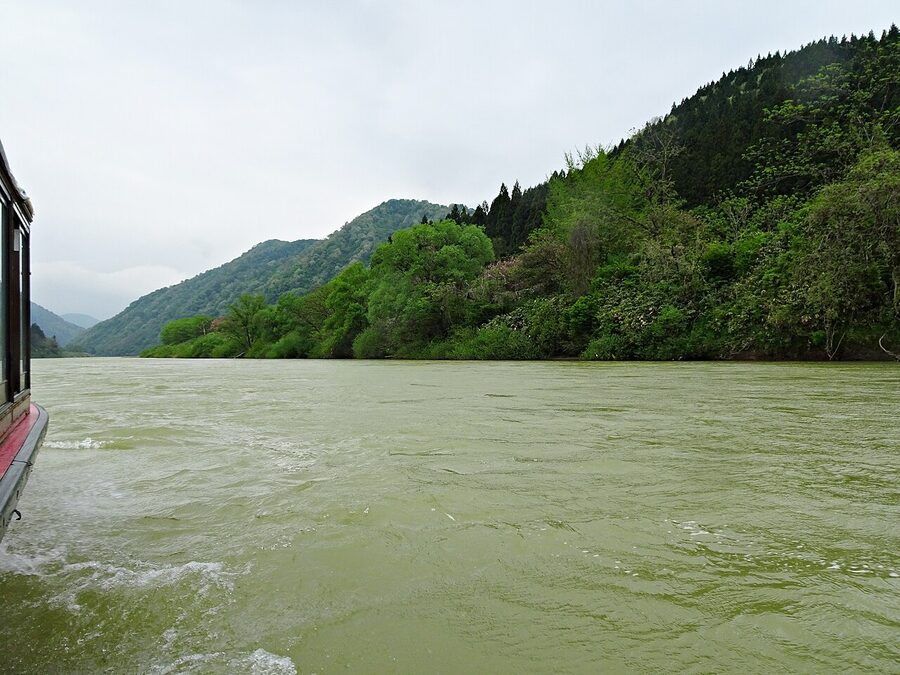 Wooden Mogami River boat with thatched canopy
